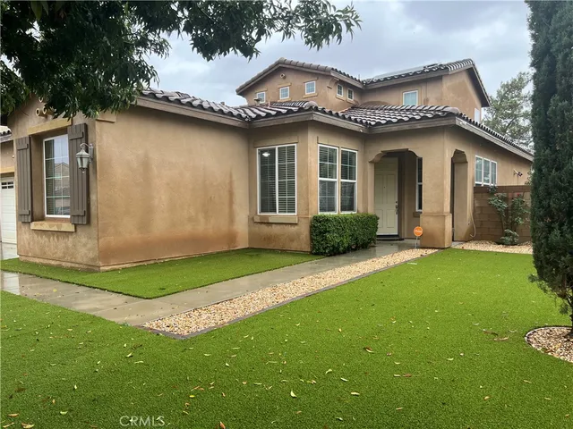 a house view with a garden space
