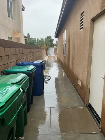 a view of a patio with chairs and a table