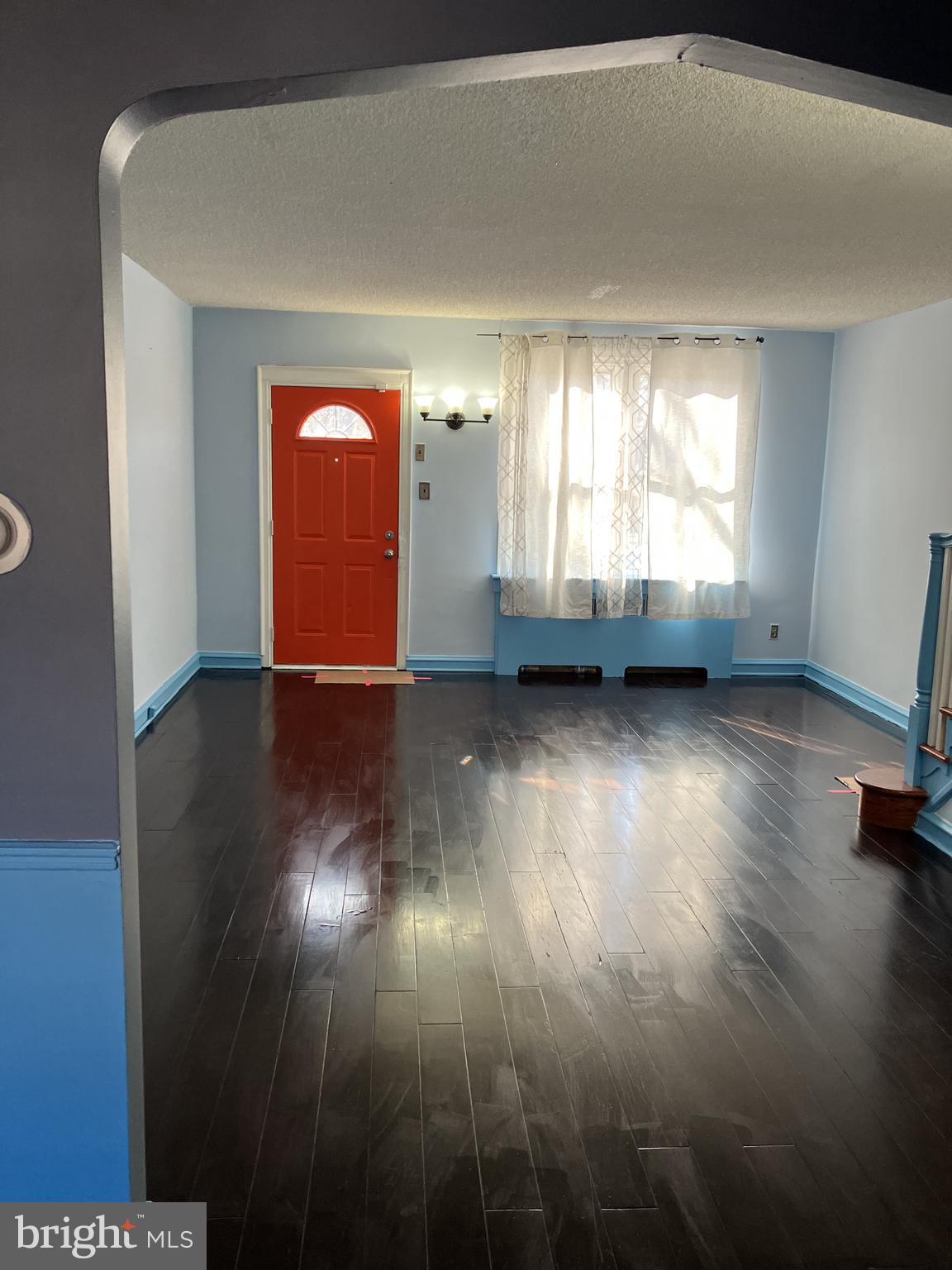3303 Glenview Street Philadelphia, PA 19149 - Photo 2 of 7 a view of empty room with wooden floor and fan