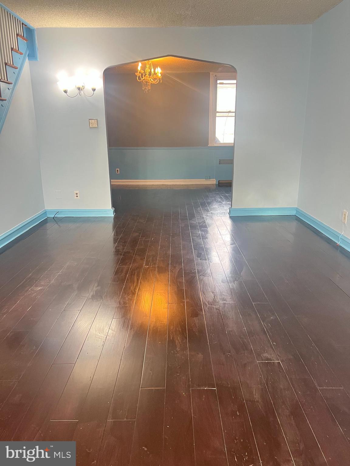 3303 Glenview Street Philadelphia, PA 19149 - Photo 3 of 7 en empty room with wooden floor and windows