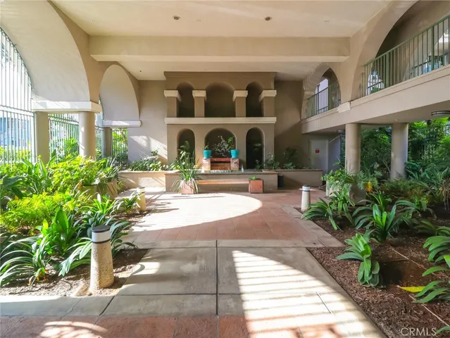 a view of a building with potted plants