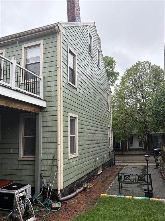 59 Washington Street Boston, MA 02129 - Photo 6 of 15 a view of backyard with sitting area