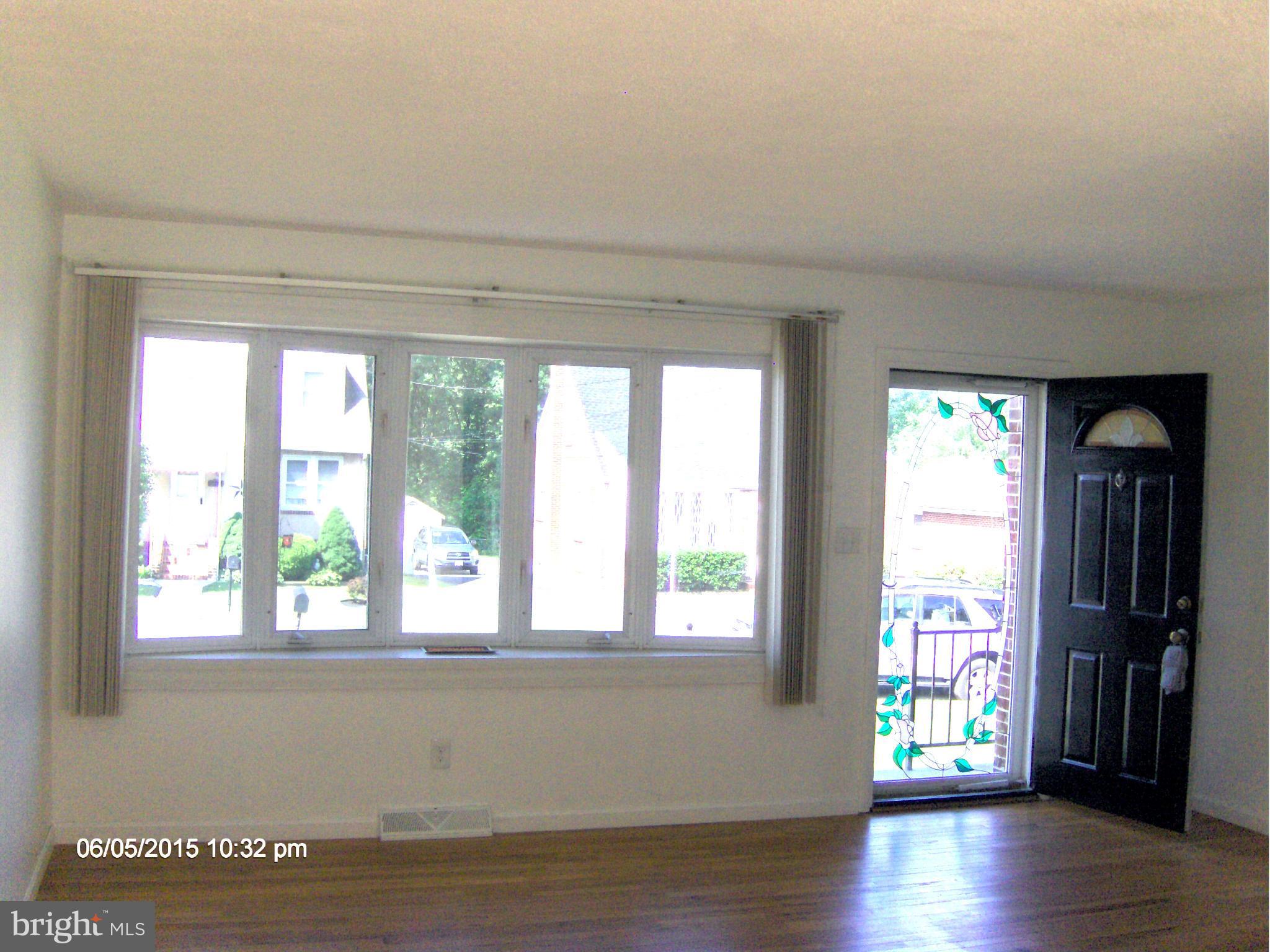 1006 Rosedale Avenue Baltimore, MD 21237 - Photo 4 of 18 a view of an entryway with wooden floor