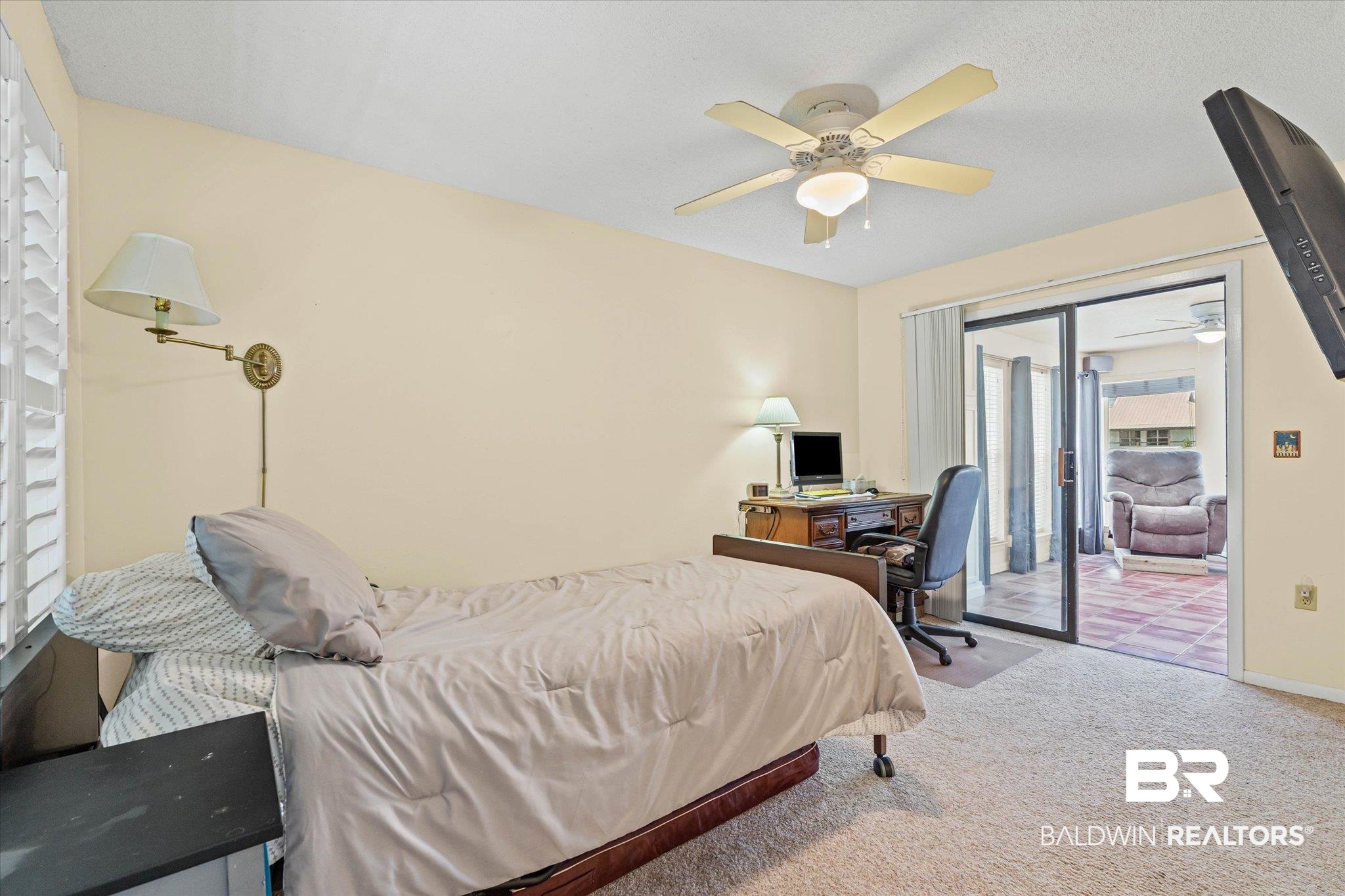 33129 River Road Orange Beach, AL 36561 - Photo 9 of 34 Bedroom with carpet flooring, access to outside, a ceiling fan, and an office area