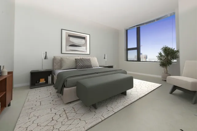 a bedroom with a bed and a couch