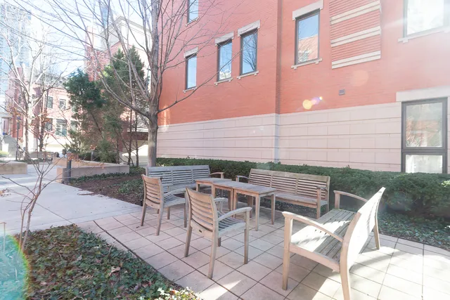 a view of a patio with a table and chairs