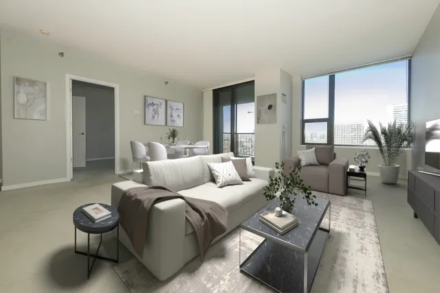 a living room with furniture and a large window