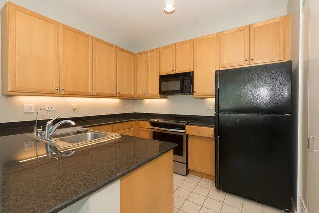 a kitchen with a sink a stove and refrigerator