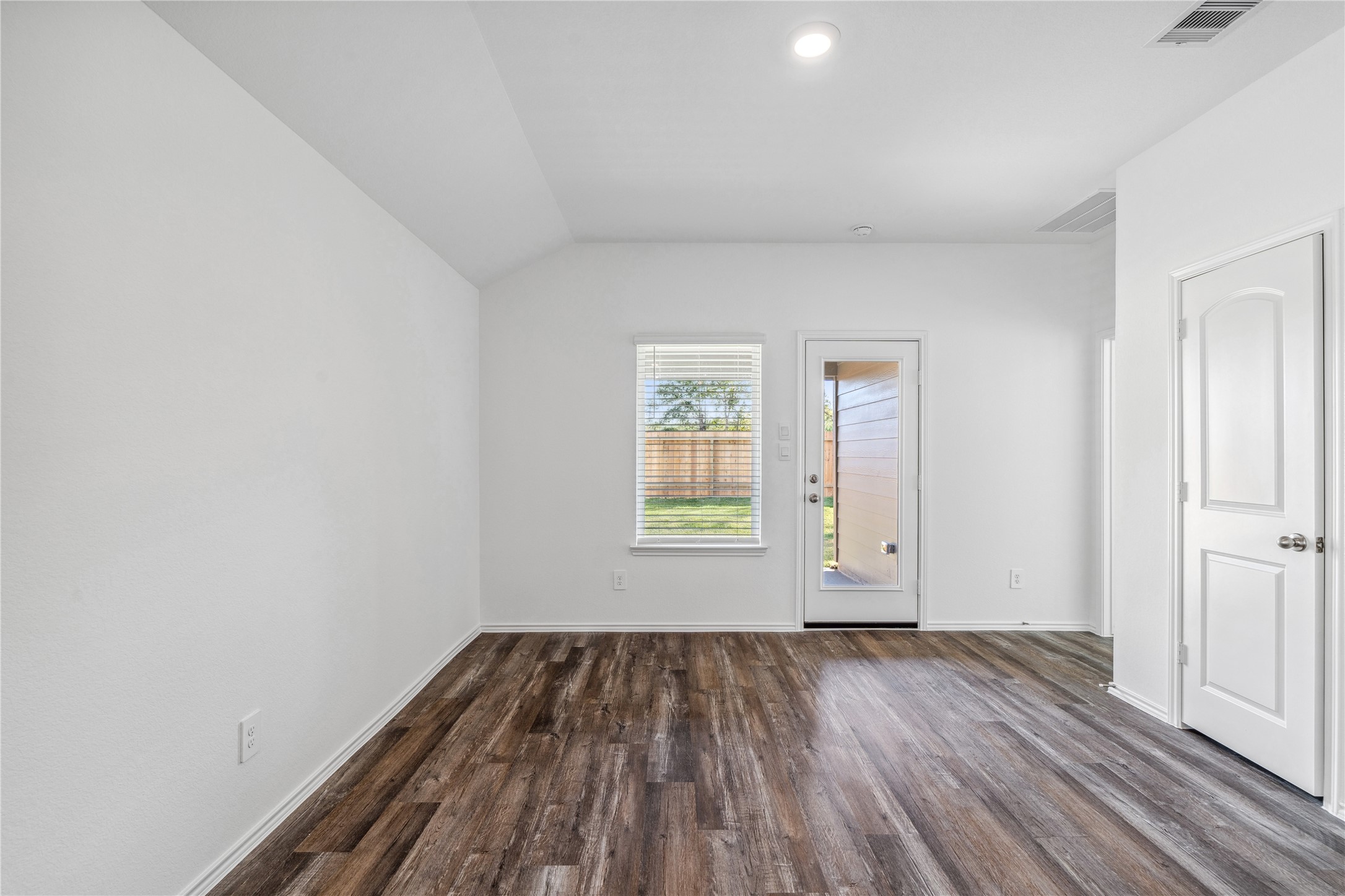 5930 Hampton Valley Dr Spring Spring, TX 77373 - Photo 11 of 35 an empty room with wooden floor and windows