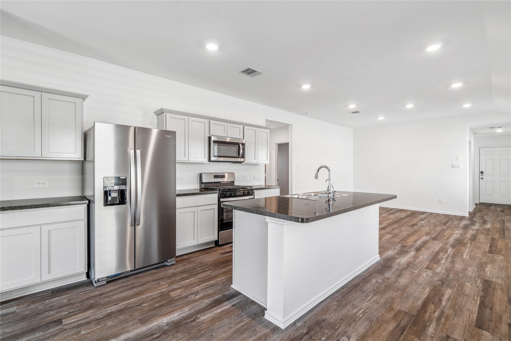 5930 Hampton Valley Dr Spring Spring, TX 77373 - Photo 12 of 35 a kitchen with kitchen island a sink stainless steel appliances and counter space
