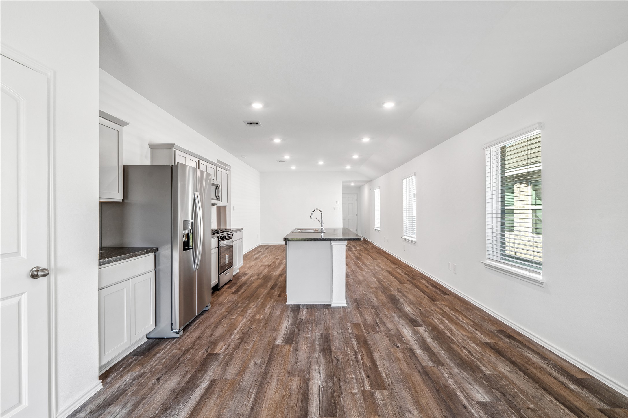 5930 Hampton Valley Dr Spring Spring, TX 77373 - Photo 13 of 35 a view of a kitchen with a refrigerator a sink and dishwasher