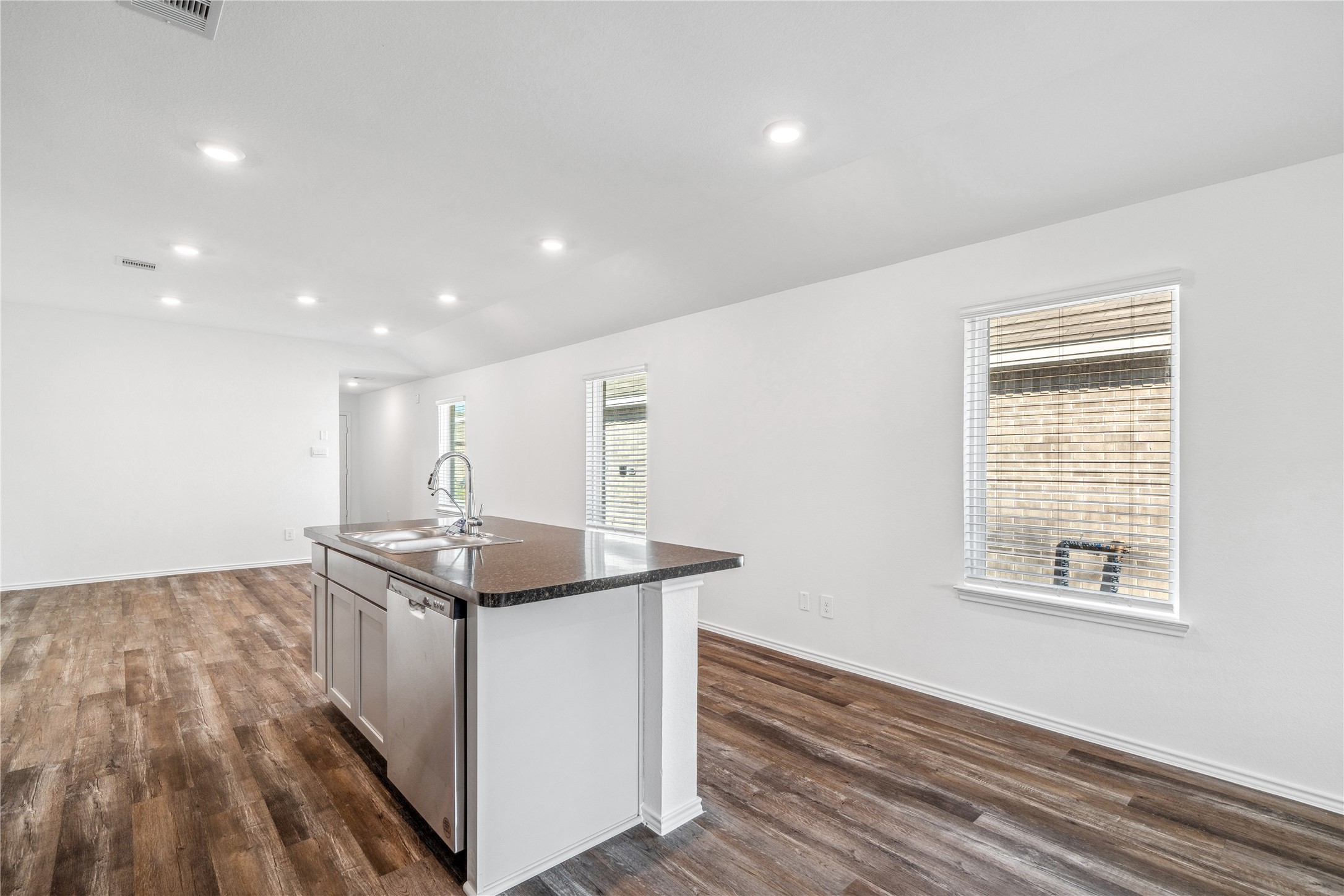 5930 Hampton Valley Dr Spring Spring, TX 77373 - Photo 15 of 35 a kitchen with stainless steel appliances granite countertop a sink and a stove top oven