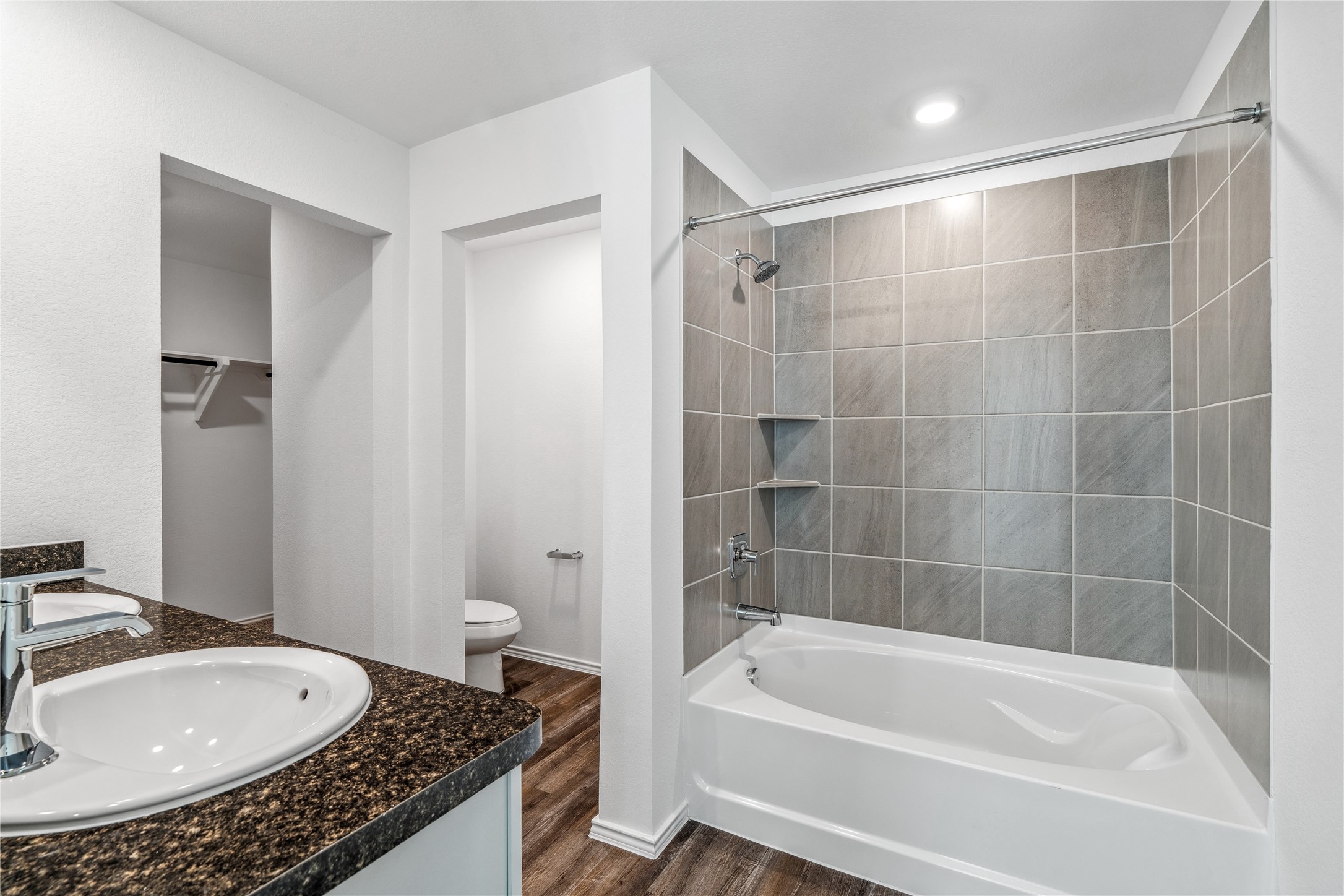 5930 Hampton Valley Dr Spring Spring, TX 77373 - Photo 20 of 35 a bathroom with a granite countertop sink a toilet and bathtub