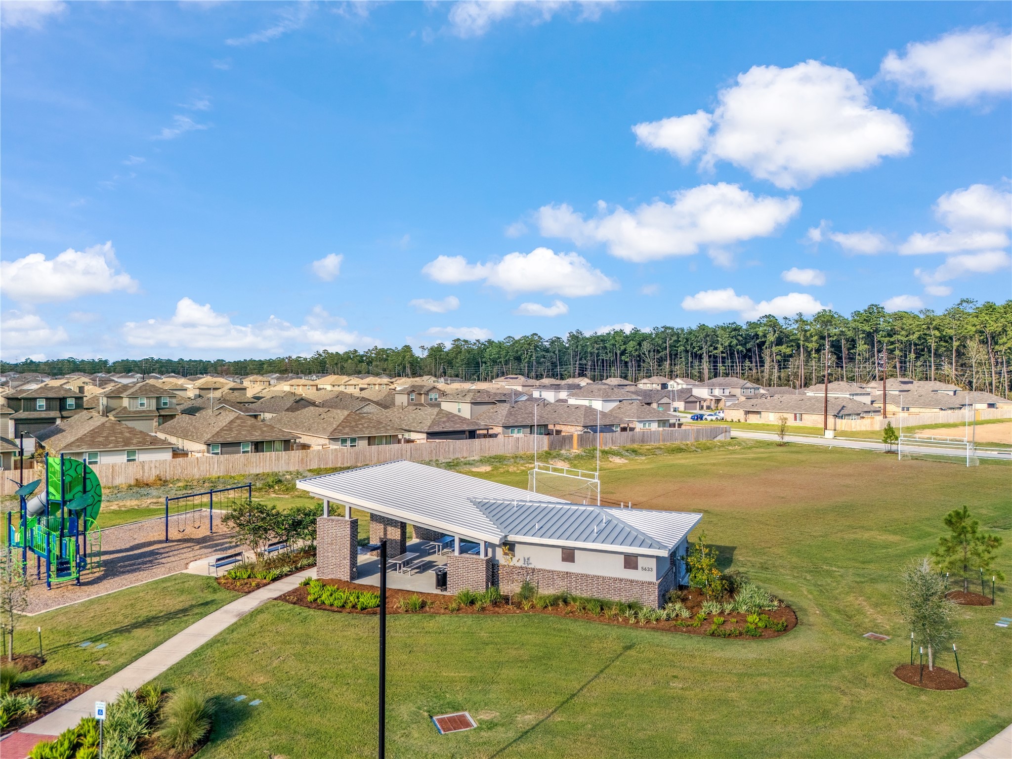 5930 Hampton Valley Dr Spring Spring, TX 77373 - Photo 35 of 35 a view of a swimming pool with lawn chairs
