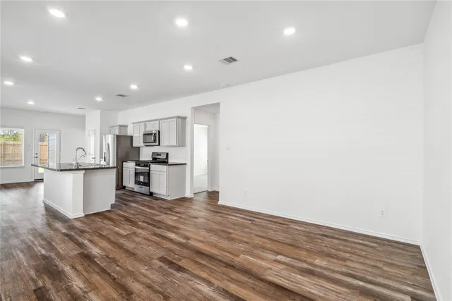 a view of kitchen with wooden floor
