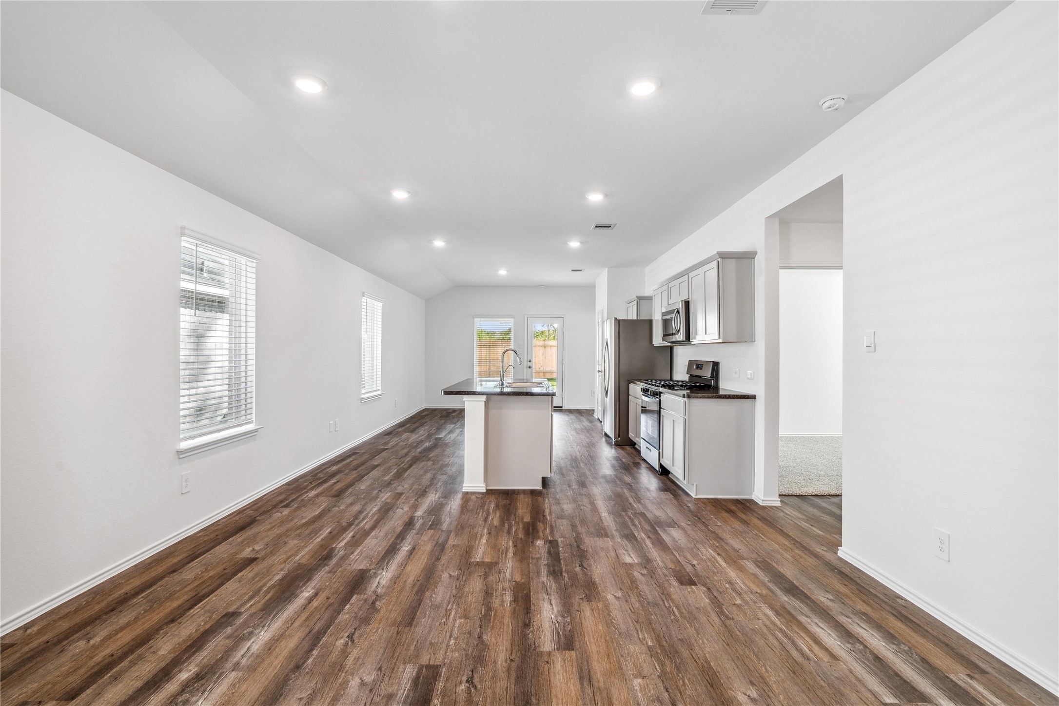 5930 Hampton Valley Dr Spring Spring, TX 77373 - Photo 8 of 35 a view of kitchen with wooden floor