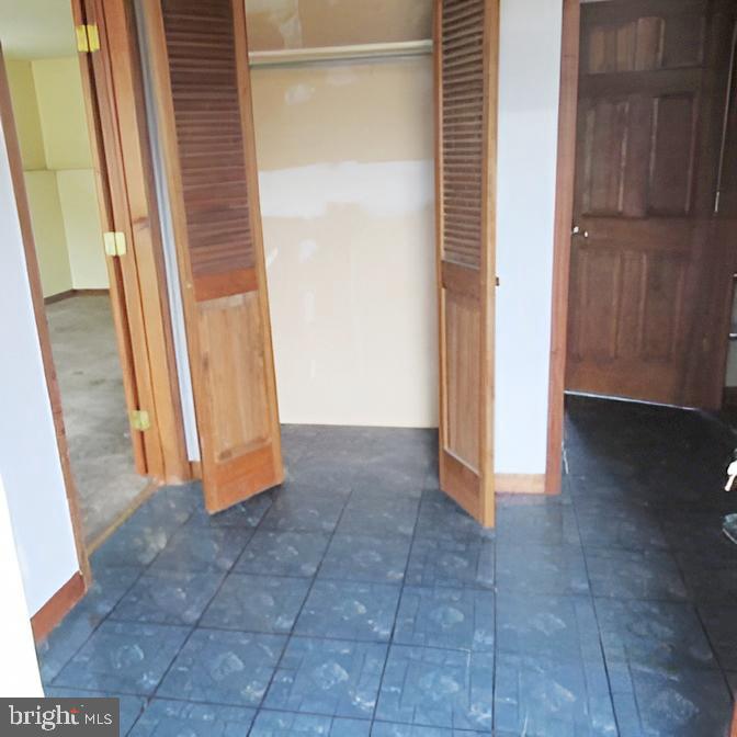 718 Mayo Road Glen Burnie, MD 21061 - Photo 17 of 48 Spacious closet with elegant wooden doors.
