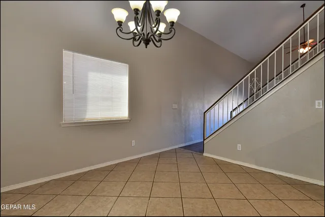 a kitchen with granite countertop a sink and cabinets