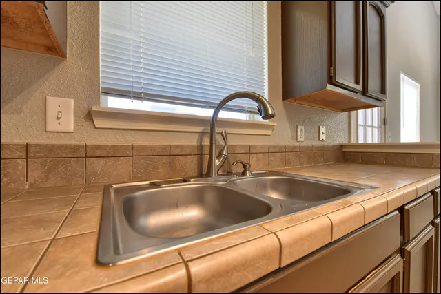 a view of staircase with white walls and a window