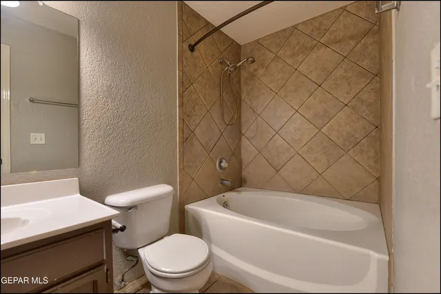 a bathroom with a sink toilet and mirror