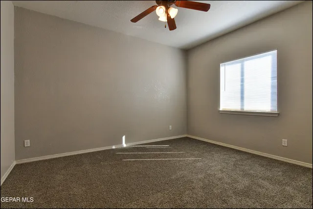 an aerial view of a house with outdoor space