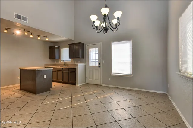 a stove top oven sitting inside of a kitchen