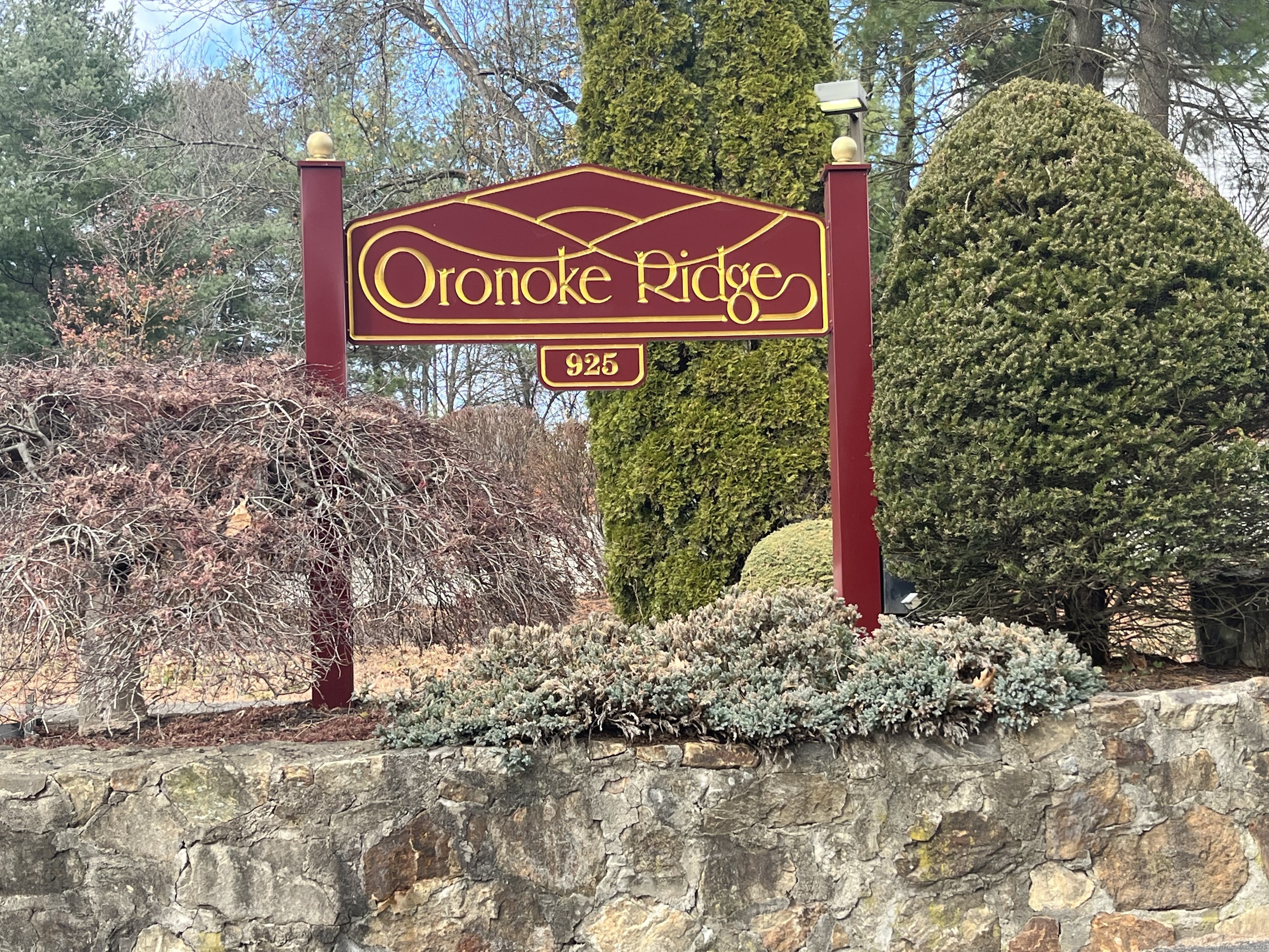 925 Oronoke Road, Unit 34G Waterbury, CT 06708 - Photo 1 of 1 a sign broad in front of a tree