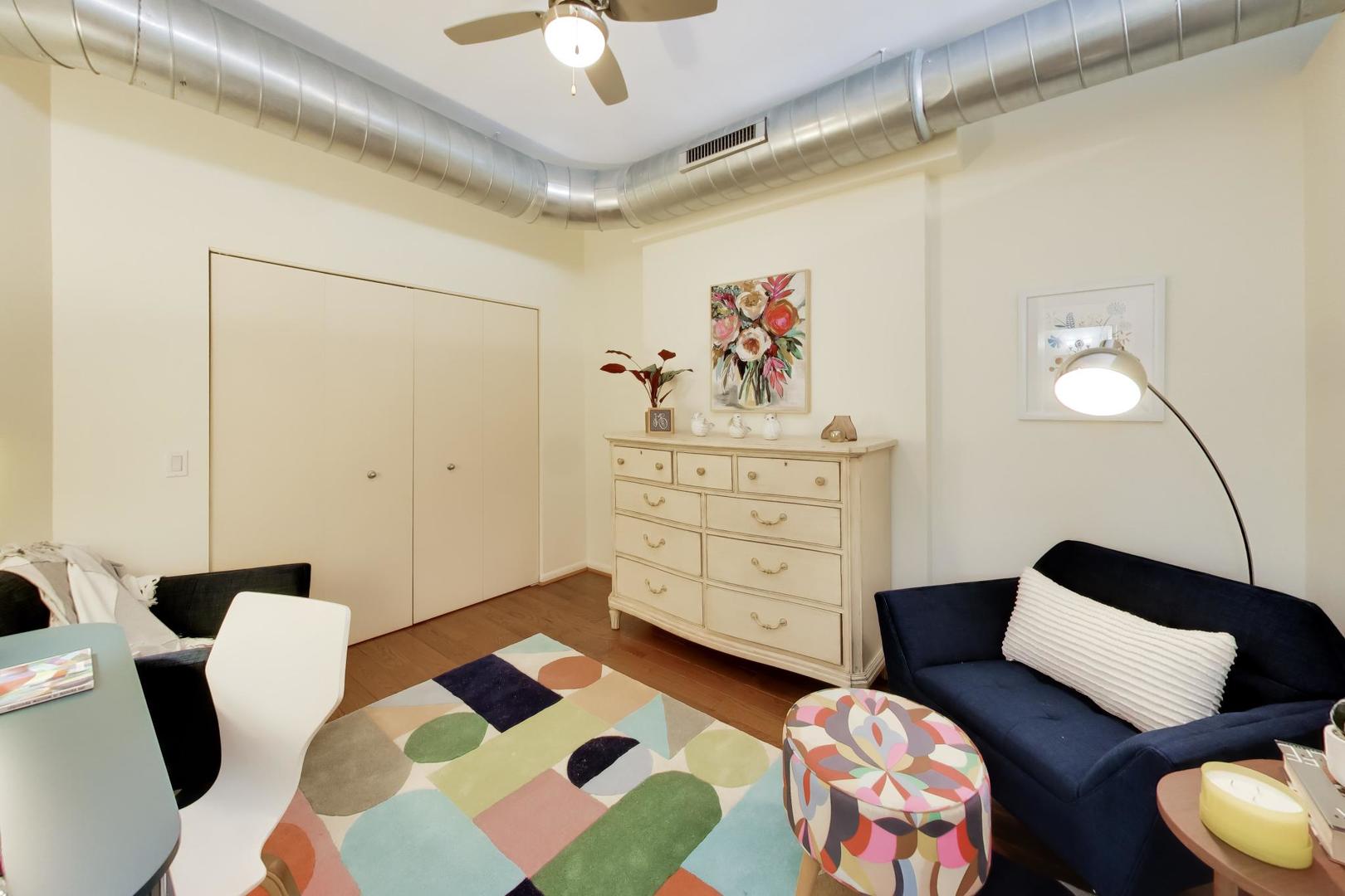 1200 West Monroe Street, Unit 502 Chicago, IL 60607 - Photo 18 of 34 a bedroom with a bed and wooden floor
