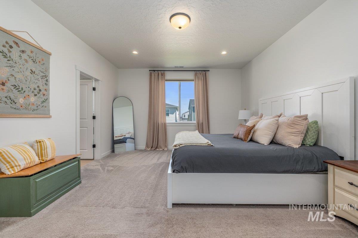 1380 West Chilitna Street Meridian, ID 83642 - Photo 25 of 50 Spacious room featuring neutral carpet flooring, recessed lighting, and a window with blinds and drapes