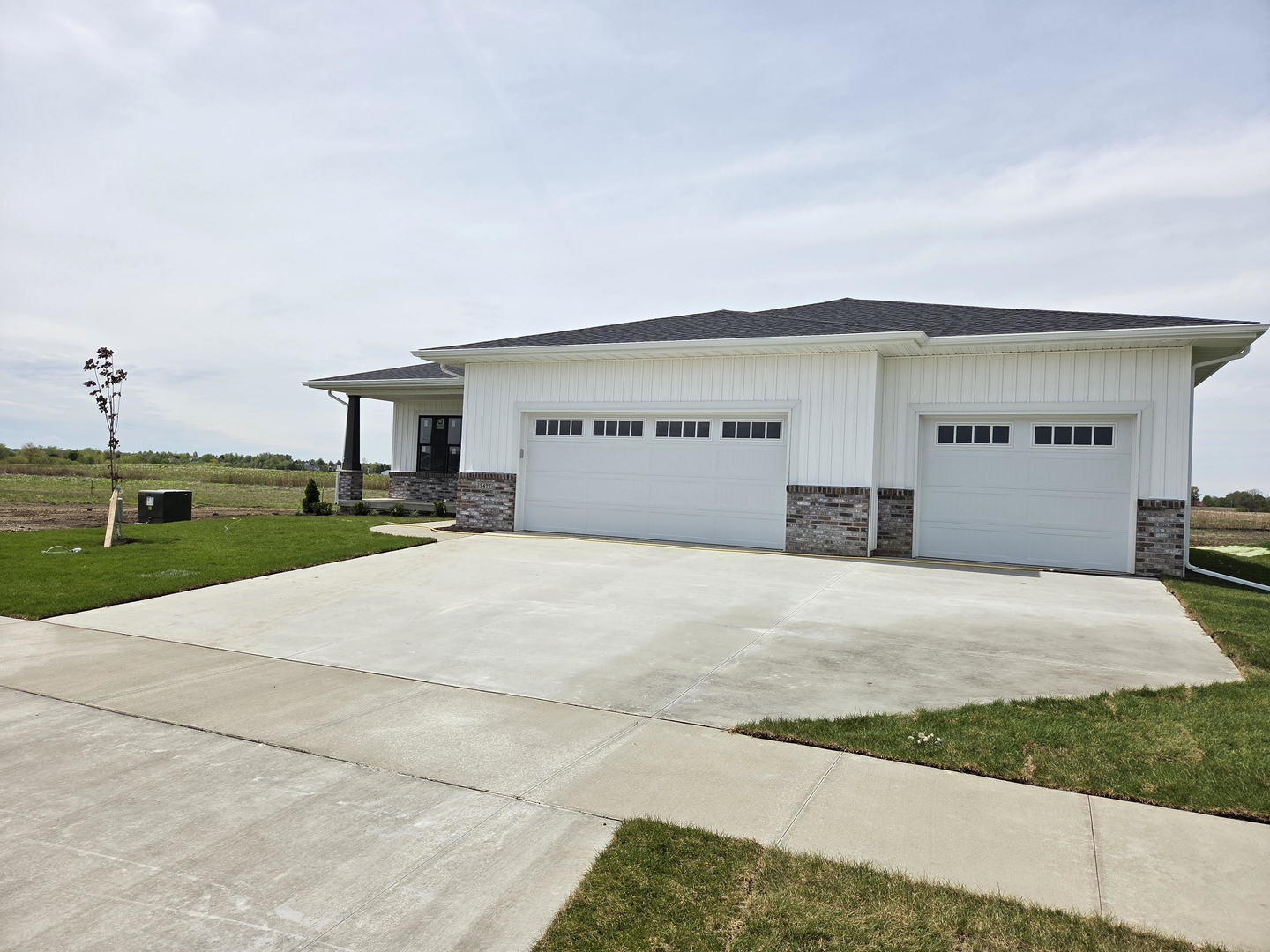 2477 Stanfield Lane Normal, IL 61761 - Photo 2 of 48 a front view of a house with a yard and garage