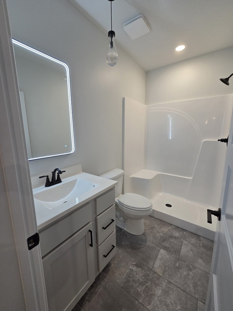 2477 Stanfield Lane Normal, IL 61761 - Photo 22 of 48 a bathroom with a sink a toilet and shower