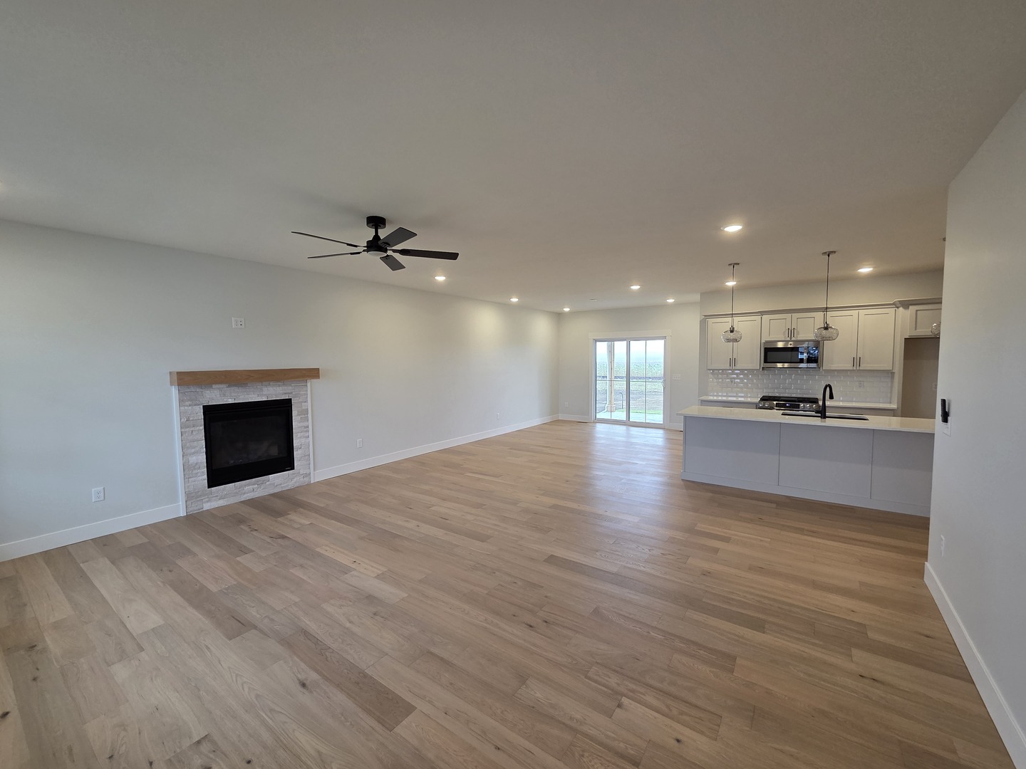 2477 Stanfield Lane Normal, IL 61761 - Photo 7 of 48 a view of a kitchen with a sink and a oven