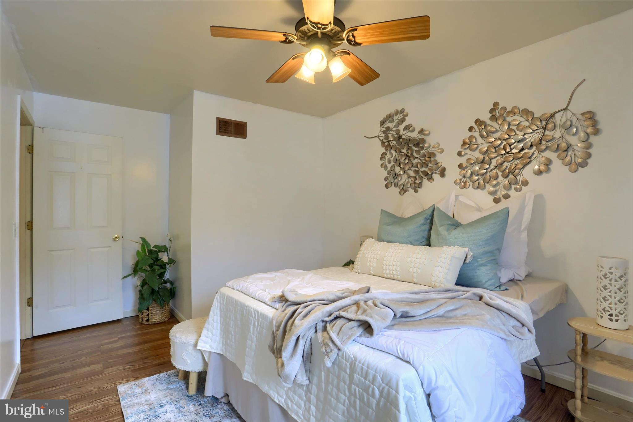 201 Overview Circle West Red Lion, PA 17356 - Photo 15 of 29 a bedroom with a bed and a chandelier