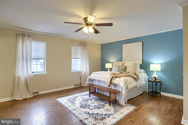 a bed room with a bed and a chandelier