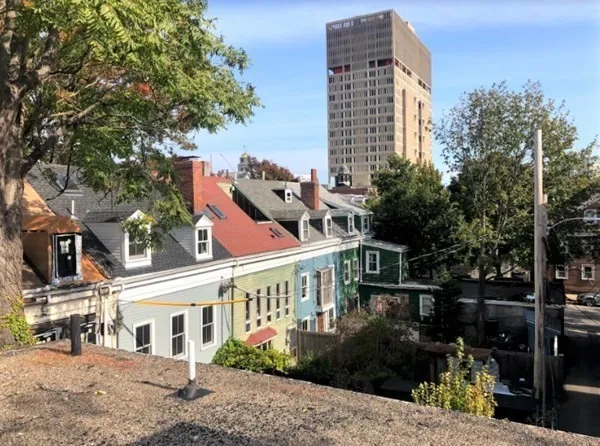 a front view of a building with street view