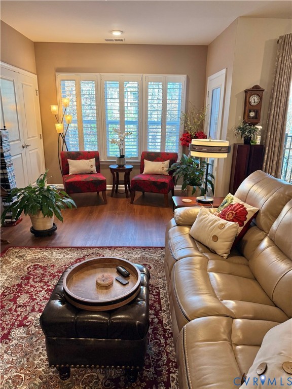 1003 Westwood Village Lane, Unit 303 Midlothian, VA 23114 - Photo 12 of 22 a living room with furniture and a fireplace