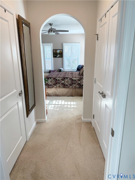 1003 Westwood Village Lane, Unit 303 Midlothian, VA 23114 - Photo 16 of 22 a view of a hallway with wooden floor and a livingroom