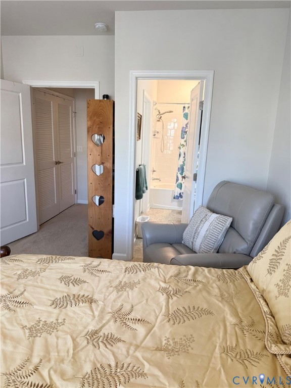 1003 Westwood Village Lane, Unit 303 Midlothian, VA 23114 - Photo 20 of 22 a bed room with a bed and a couch