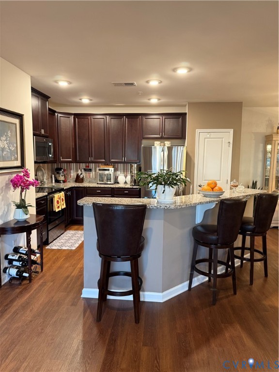 1003 Westwood Village Lane, Unit 303 Midlothian, VA 23114 - Photo 2 of 22 a kitchen with a dining table chairs workspace and a sink