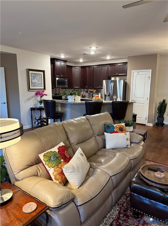 1003 Westwood Village Lane, Unit 303 Midlothian, VA 23114 - Photo 7 of 22 a living room with furniture and a wooden floor