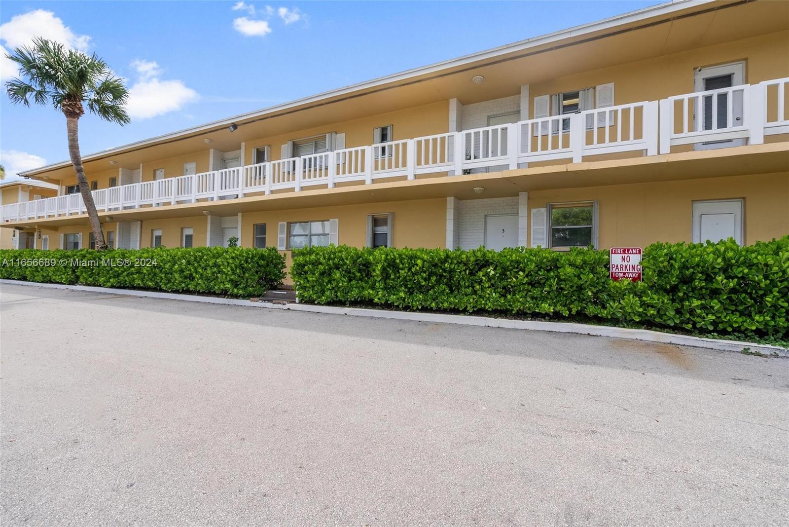 440 Southeast 2nd Avenue, Unit 3 Deerfield Beach, FL 33441 - Photo 12 of 14 a front view of a house with a yard and potted plants