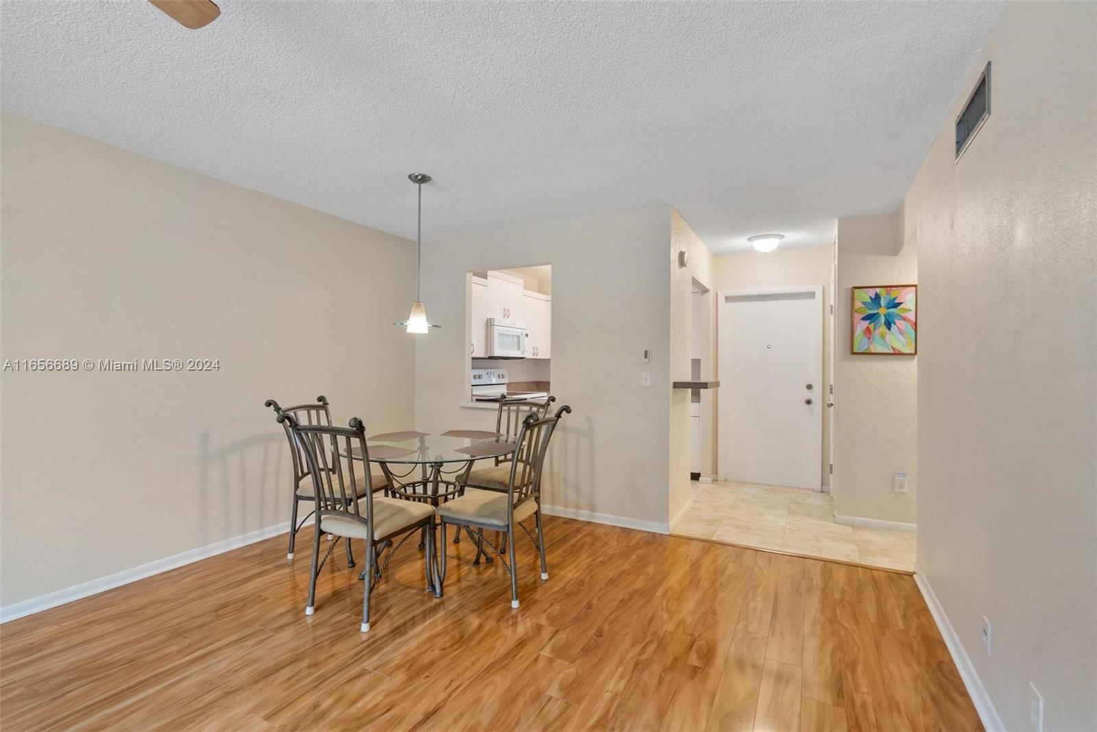 440 Southeast 2nd Avenue, Unit 3 Deerfield Beach, FL 33441 - Photo 2 of 14 a view of a dining room with furniture and wooden floor