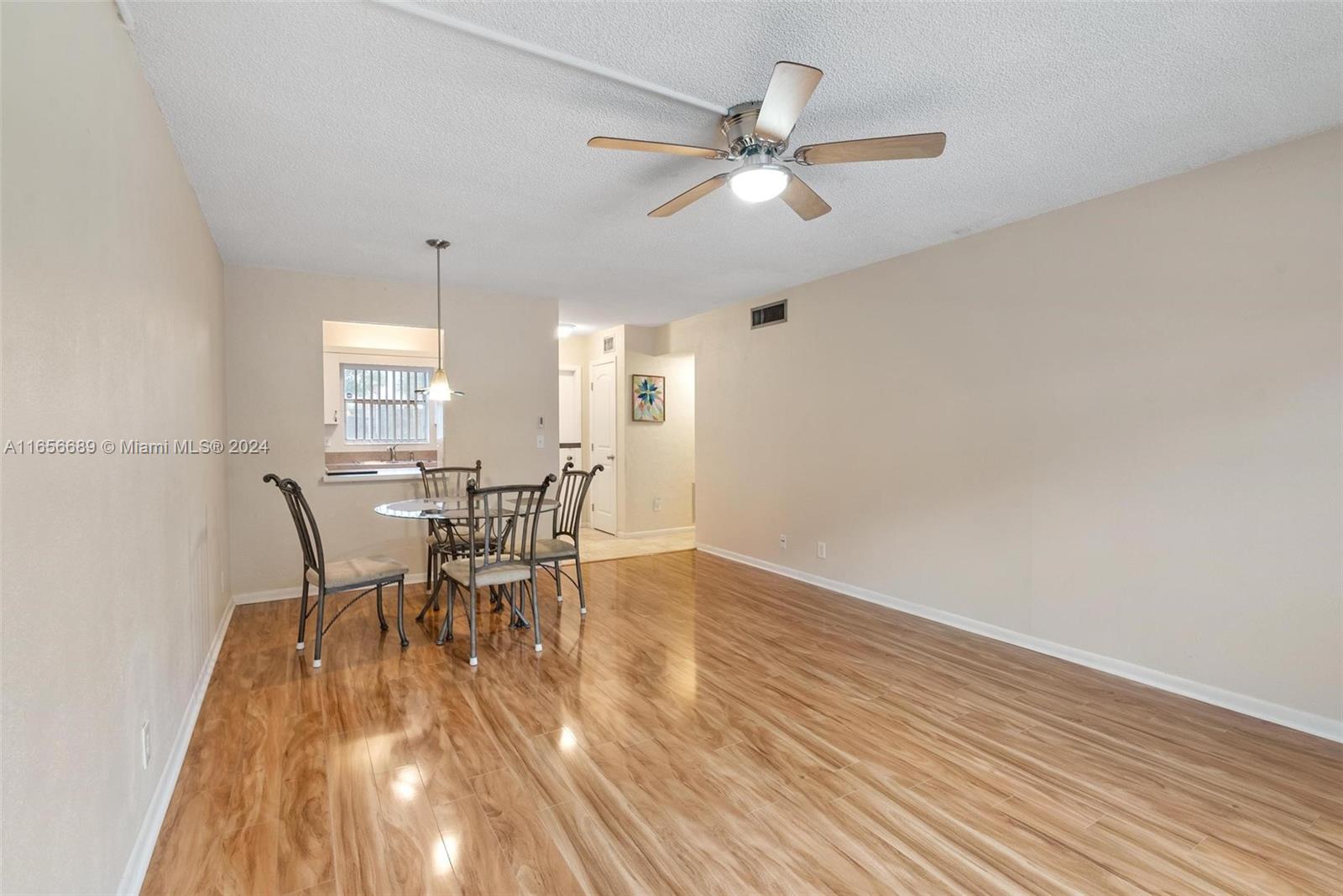 440 Southeast 2nd Avenue, Unit 3 Deerfield Beach, FL 33441 - Photo 3 of 14 a view of a dining room with furniture and window