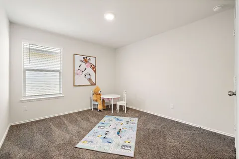 a view of a livingroom with furniture and staircase