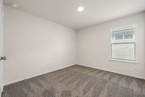 a bathroom with a double vanity sink mirror and toilet