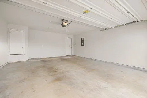 a view of a backyard with plants and a garden