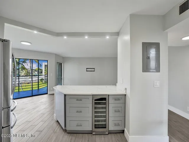 a view of room with window and wooden floor