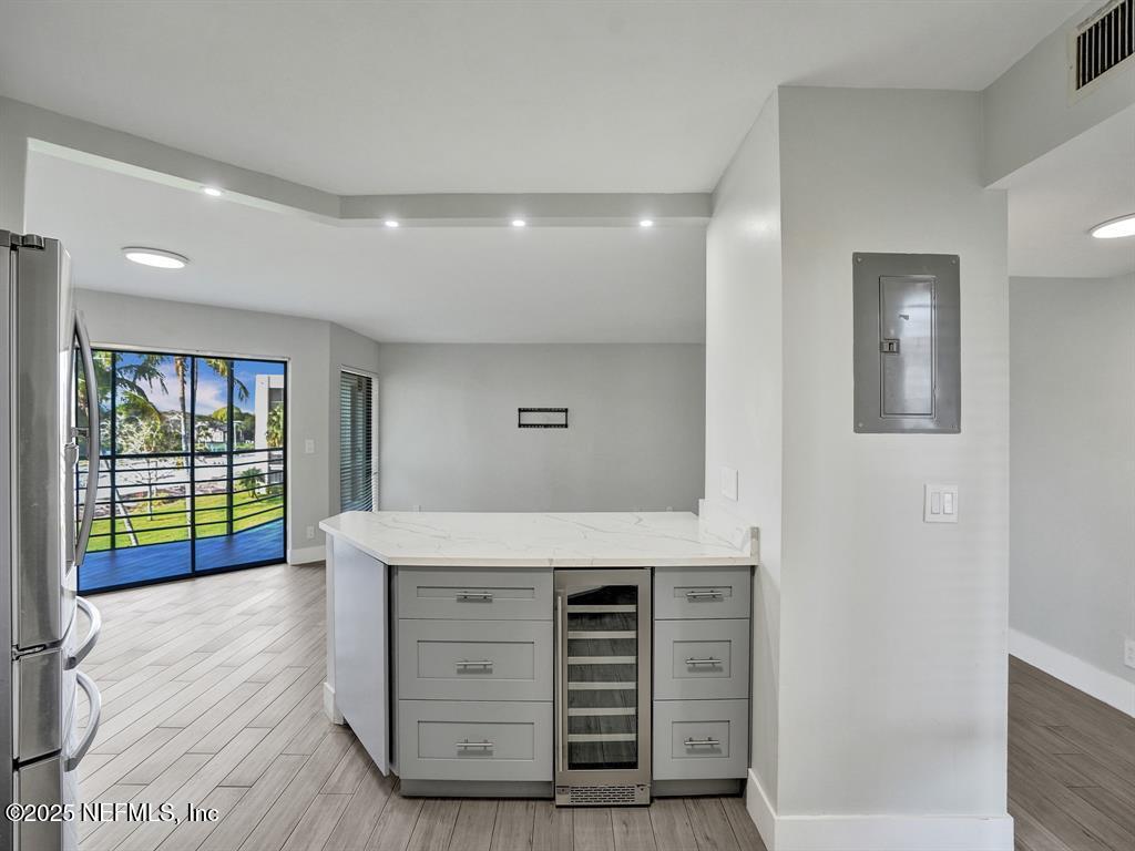 5851 Camino Del Sol, Unit 305 Boca Raton, FL 33433 - Photo 12 of 47 a view of room with window and wooden floor