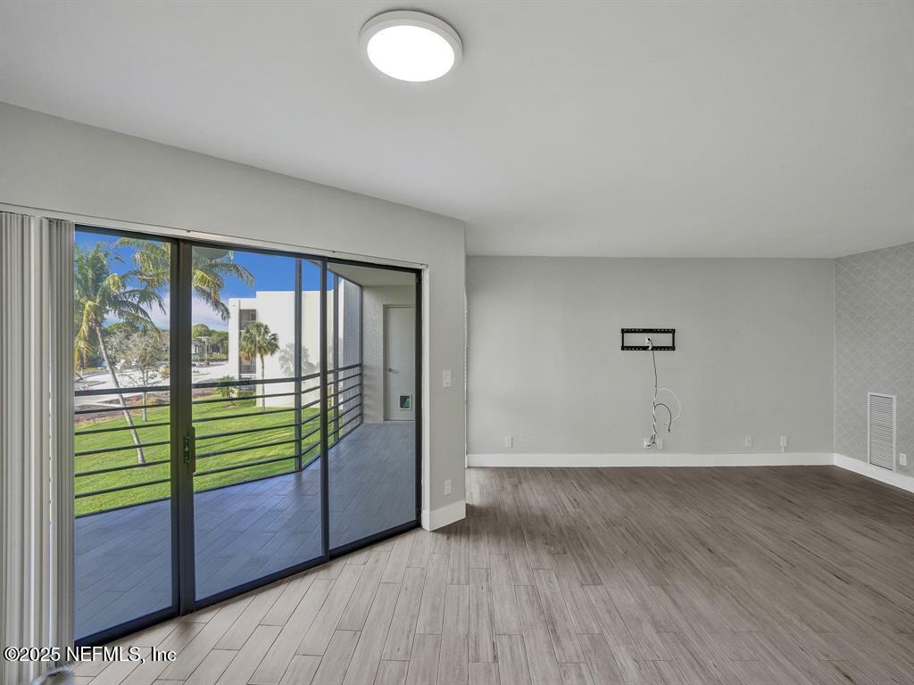 5851 Camino Del Sol, Unit 305 Boca Raton, FL 33433 - Photo 18 of 47 a view of an empty room with a window