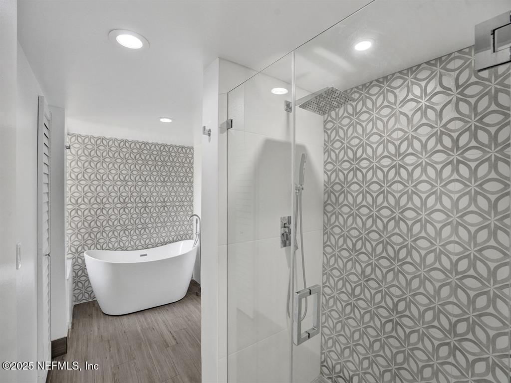 5851 Camino Del Sol, Unit 305 Boca Raton, FL 33433 - Photo 25 of 47 a bathroom with a bathtub and shower